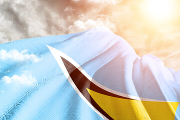 Saint Lucia national flag cloth fabric waving on beautiful cloudy Background.
