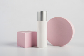 Plastic white tube for cream or lotion. Skin care or sunscreen cosmetic with stylish props on white background.