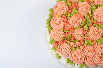 Cake decorated in the shape of basket with flowers isolated on white background.