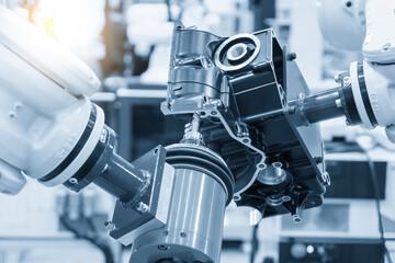 Closeup scene the milling spindle attached on the robotic arm finish cut the aluminum gear case.