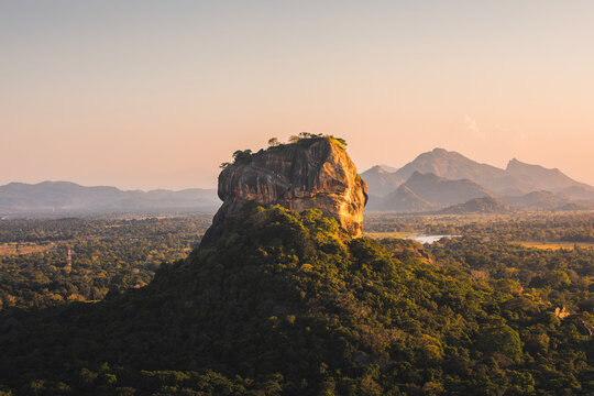 Sigiriya rock also known as Lion Rock at golden light of sunset. Beautiful landscape in Sri lanka..
