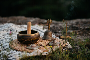 Singing bowl, Tingsha and Gantha Buddhist bell, sunset meditation.