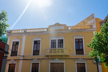 Old yellow house in a Spanish town - 774810997