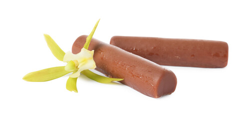 Glazed curd cheese bars and vanilla flower isolated on white