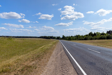 Fototapeta premium paved road along and blue sky