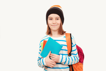 Cute teenager with school backpack. Back to school. Boy in casual clothes with books for studing.