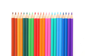 A close-up of colorful crayons isolated on a white background
