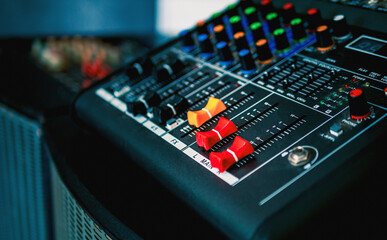 Close-up of sound recording equipment knobs.Mixer control. Music engineer. Backstage controls on an...