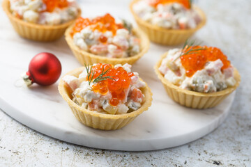 Traditional Russian salad with red caviar