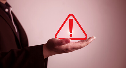 Danger and error alert concept. Businessman shows symbol notification warning triangle. Maintenance...