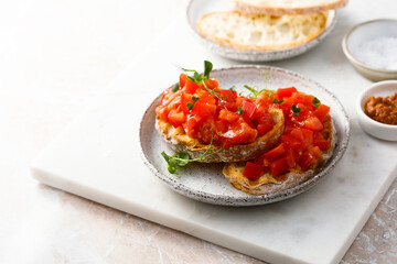 Traditional tomato bruschetta with greens