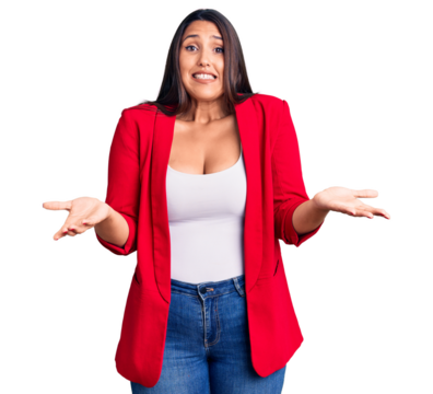 Young beautiful brunette woman wearing elegant clothes clueless and confused expression with arms and hands raised. doubt concept.