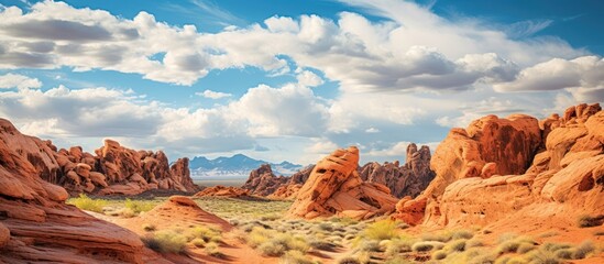 Valley of Fire State Park against a bright blue, cloudy sky