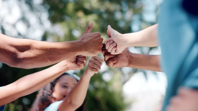 Hands, thumbs up and people volunteering outdoor, NGO charity and social development support with trust in team. Community service, huddle and collaboration with solidarity for climate agreement