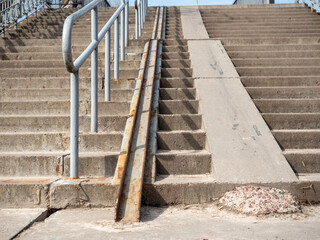 Staircase with iron railings on the street, closeup of photo