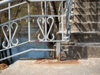 Metal handrails on the stairs in the park