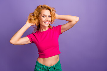 Plakaty  Photo of pretty cute adorable woman wear trendy pink clothes touch hairdo empty space isolated on purple color background
