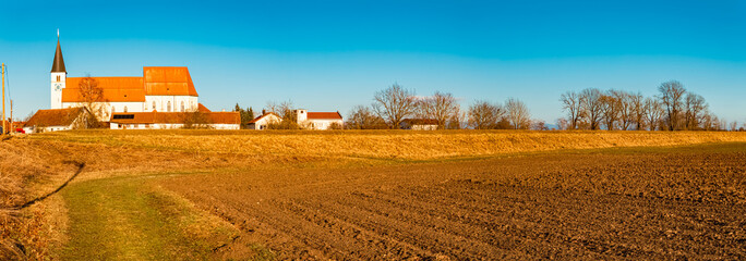 High resolution stitched winter panorama with a church on a sunny day at Sossau, Straubing-Bogen, Bavaria, Germany