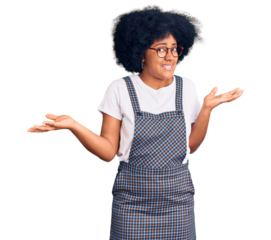 Young african american girl wearing casual clothes clueless and confused expression with arms and hands raised. doubt concept.