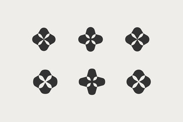 Four-leaf flower element. Set of 4 geometric emblem. Modern abstract linear shape for emblem, badge, insignia.