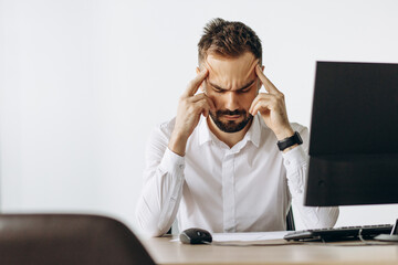 Business man having headache at work place