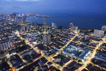 A view of the cityscape of Penang in Malaysia during the blue hour of the day.