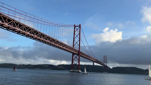 View of 25th of April Bridge in Lisbon, Portugal. Tagus river.