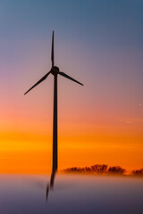 Obraz premium Sunset with wind turbine silhouettes and reflections on a car roof near Kugl, Simbach bei Landau, Dingolfing-Landau, Bavaria, Germany