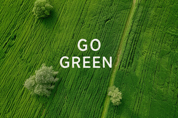 Aerial view of a green field landscape with Go Green text
