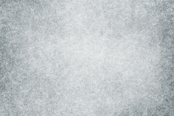White grey felt material. Surface of felted fabric texture abstract background in gray color. High...