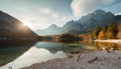 awesome alpine highlands in sunny day amazing mountain lake in slovenia in sunny day famous jasna lake in julian alps wonderful nature landscape in autumn popular travel and hiking destination - obrazy, fototapety, plakaty