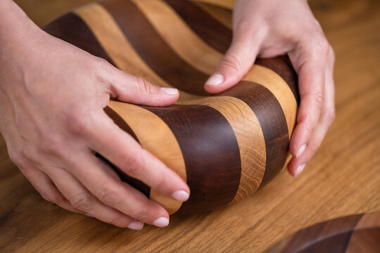 Female hand with elegant unique wooden handcrafted item