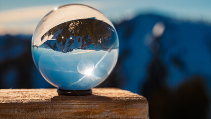 Crystal ball alpine winter landscape shot with a chapel at Mount Wallberg, Rottach-Egern, Lake Tegernsee, Miesbach, Bavaria, Germany - obrazy, fototapety, plakaty