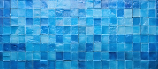 Close up of a vibrant blue tiled wall against a plain white background, showcasing a modern and clean aesthetic