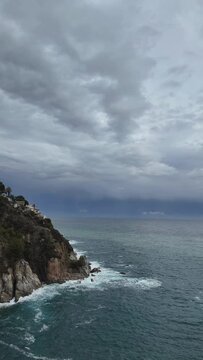 Time lapse of panoramic view of  stormy clouds, sea and the mediterranean bay, vertical