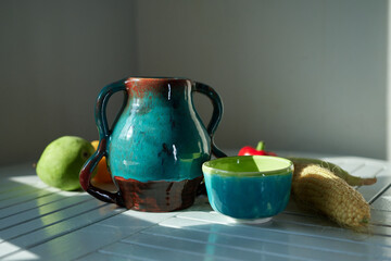 Still life with corn, pear, pepper and an old ceramic jug. Healthy eating concept. High quality...
