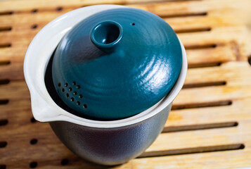 Chinesee teapot on tea board