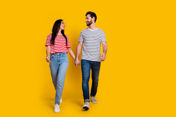 Full size photo of couple girl guy dressed striped t-shirt look at each other walking on valentine...