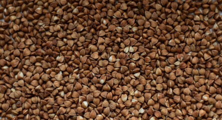 Texture of loose buckwheat on the table