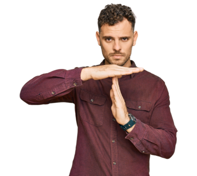 Young hispanic man wearing casual clothes doing time out gesture with hands, frustrated and serious face