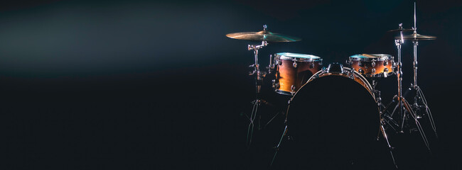 Drum set on a black background isolated, copy space.