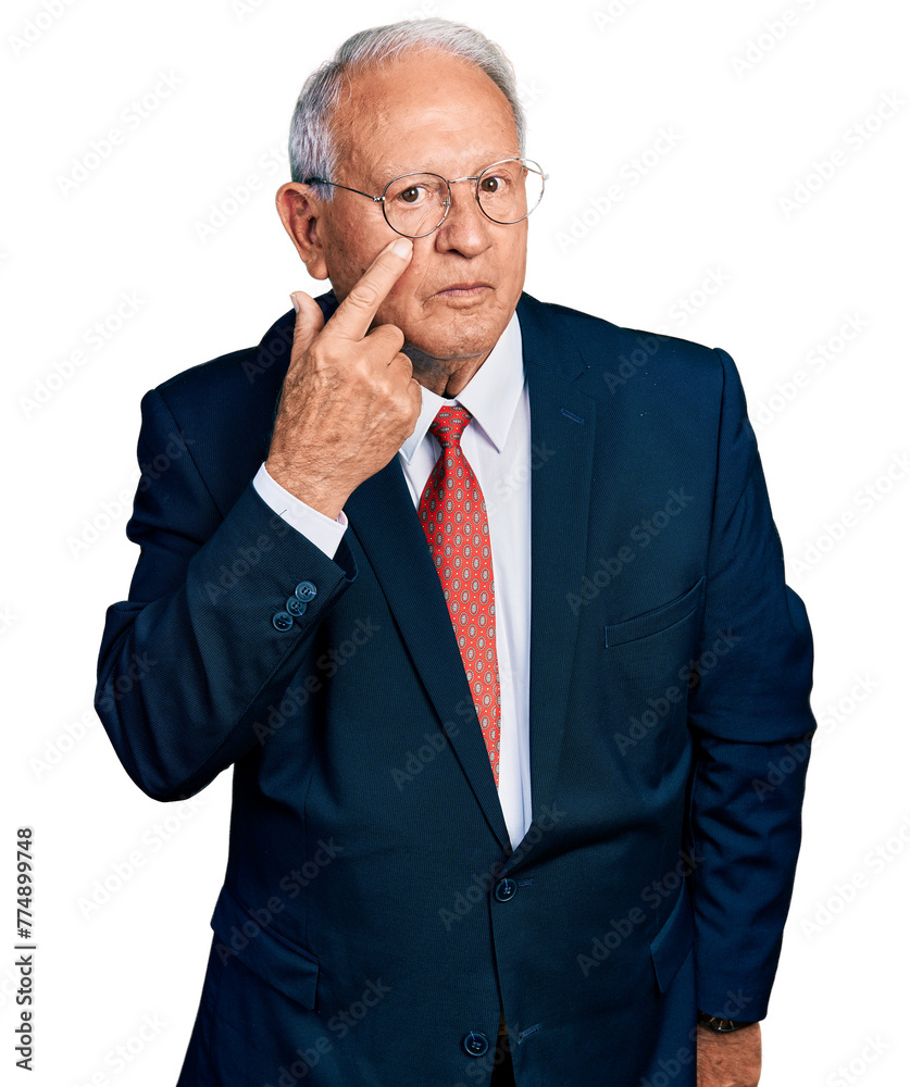 Poster senior man with grey hair wearing business suit and glasses pointing to the eye watching you gesture