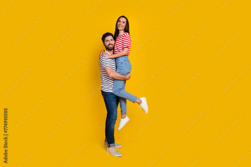 Canvas Prints Full length photo of boyfriend hold on hands his gorgeous girlfriend wear striped t-shirt isolated on vivid yellow color background