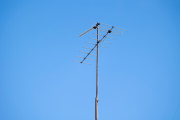 These antennas are commonly seen on residential buildings, providing access to TV signals. They dot...