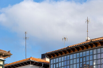 These antennas are commonly seen on residential buildings, providing access to TV signals. They dot...