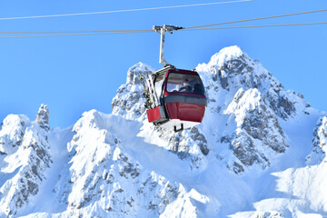 Fototapeta na wymiar Ski lifts over the slopes of Courchevel ski resort
