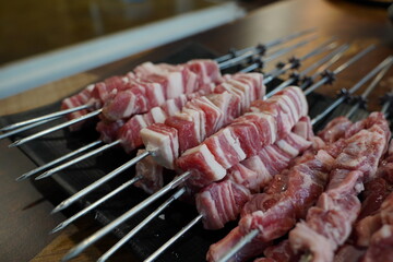 Fresh raw lamb skewers in restaurant