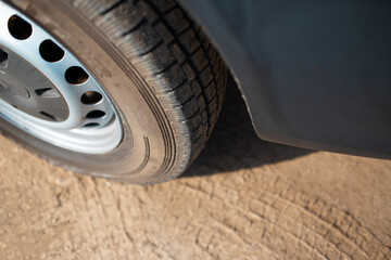 Close-up of car wheel on the road.