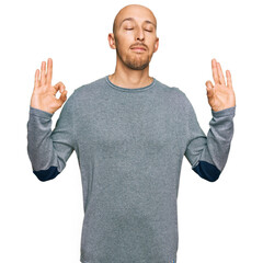 Bald man with beard wearing casual clothes relax and smiling with eyes closed doing meditation gesture with fingers. yoga concept.