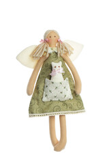 Beautiful handmade doll in green dress isolated on white background. Girl with wings holding cat